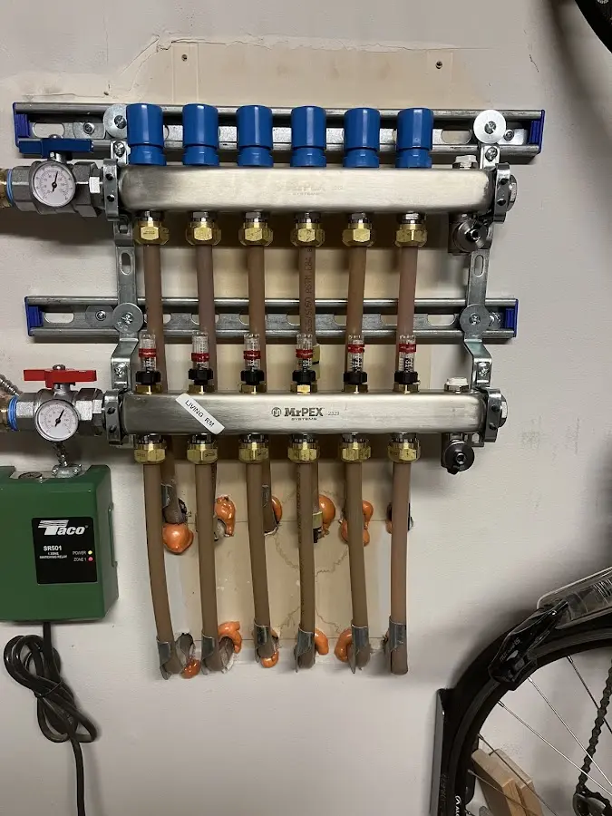 Plumber performing Water Heater Repair at a residential property in Andover